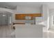 Open kitchen with island and breakfast bar at 1739 Morning Star Dr, Clermont, FL 34714
