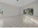 Large living area with sliding doors opening to the pool at 1739 Morning Star Dr, Clermont, FL 34714
