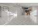 Open living and kitchen area with tile flooring at 1739 Morning Star Dr, Clermont, FL 34714