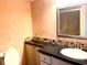 Bathroom with granite vanity and updated fixtures at 1776 6Th St Nw # 209, Winter Haven, FL 33881