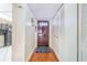 Bright condo entryway with wood floors and built-in storage at 1776 6Th St Nw # 209, Winter Haven, FL 33881