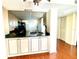 Open kitchen with granite counters and breakfast bar at 1776 6Th St Nw # 209, Winter Haven, FL 33881