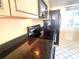 Kitchen area with granite countertops and microwave at 1776 6Th St Nw # 209, Winter Haven, FL 33881