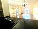 Kitchen with granite countertops and black appliances at 1776 6Th St Nw # 209, Winter Haven, FL 33881