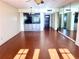 Bright living room with hardwood floors and access to balcony at 1776 6Th St Nw # 209, Winter Haven, FL 33881