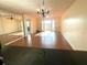 Living room with hardwood floors and balcony access at 1776 6Th St Nw # 209, Winter Haven, FL 33881