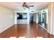 Bright living room with hardwood floors and access to kitchen at 1776 6Th St Nw # 209, Winter Haven, FL 33881