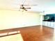 Living room with hardwood floors and ceiling fan at 1776 6Th St Nw # 209, Winter Haven, FL 33881