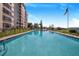 Relaxing community pool with a lake view at 1776 6Th St Nw # 209, Winter Haven, FL 33881