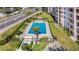 Refreshing community pool with surrounding patio area at 1776 6Th St Nw # 209, Winter Haven, FL 33881
