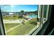 View of community pool and surrounding landscape at 1776 6Th St Nw # 209, Winter Haven, FL 33881
