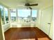 Sunroom with water views and hardwood floors at 1776 6Th St Nw # 209, Winter Haven, FL 33881