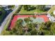 Community tennis court with red and green surface at 1776 6Th St Nw # 209, Winter Haven, FL 33881