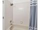 Bathroom with shower/tub combo and tiled walls at 2143 Calabria Ave, Davenport, FL 33897