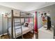 Bedroom with a bunk bed and Mickey Mouse decor at 2143 Calabria Ave, Davenport, FL 33897