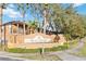 Regal Palms at Highland's Reserve community entrance with landscaping and building in background at 2143 Calabria Ave, Davenport, FL 33897