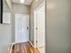 Light and bright entryway with wood-look floors and access to a bathroom at 2143 Calabria Ave, Davenport, FL 33897