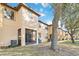 Townhouse back with screened porch, landscaping, and trees at 2143 Calabria Ave, Davenport, FL 33897