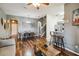 Open concept living and dining area with hardwood floors and a sliding glass door to the patio at 2143 Calabria Ave, Davenport, FL 33897