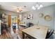 Open concept living area with hardwood floors, neutral walls and sliding glass door at 2143 Calabria Ave, Davenport, FL 33897