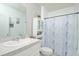 Clean bathroom with a shower/tub combo and white vanity at 233 Tiffany Ct, Kissimmee, FL 34758