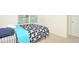 Small bedroom with a twin-size bed and window at 233 Tiffany Ct, Kissimmee, FL 34758