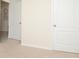Simple bedroom with two doors and carpeted floor at 233 Tiffany Ct, Kissimmee, FL 34758