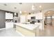 Modern kitchen with white cabinets, stainless steel appliances, and an island at 233 Tiffany Ct, Kissimmee, FL 34758