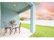 Relaxing patio with a small table and chairs, perfect for outdoor dining at 233 Tiffany Ct, Kissimmee, FL 34758