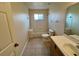 Clean bathroom with tub, toilet, and vanity at 2332 Prime Cir # B, Kissimmee, FL 34746
