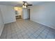 Spacious bedroom with tile floors and ceiling fan at 2332 Prime Cir # B, Kissimmee, FL 34746