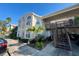 Exterior view of condo building with parking and landscaping at 2332 Prime Cir # B, Kissimmee, FL 34746