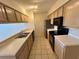 Clean kitchen with light wood cabinets and black appliances at 2332 Prime Cir # B, Kissimmee, FL 34746