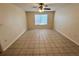 Bright living room with tile floors and ceiling fan at 2332 Prime Cir # B, Kissimmee, FL 34746