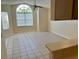 Spacious living room with tile floors and large window at 2332 Prime Cir # B, Kissimmee, FL 34746