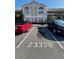 Condo parking lot with two cars parked at 2332 Prime Cir # B, Kissimmee, FL 34746
