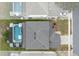 Aerial view of house with pool, showcasing backyard and neighborhood context at 256 Lancaster Dr, Davenport, FL 33897