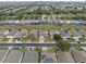 Aerial view of house and neighborhood, showing street and surrounding homes at 256 Lancaster Dr, Davenport, FL 33897