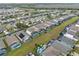 Aerial view showcasing a row of houses with pools in a residential neighborhood at 256 Lancaster Dr, Davenport, FL 33897