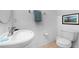 Small half bathroom with toilet and single sink vanity at 256 Lancaster Dr, Davenport, FL 33897