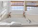 Relaxing bathroom with large garden tub and window at 256 Lancaster Dr, Davenport, FL 33897