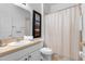 Clean bathroom with shower/tub combo, single sink vanity, and toilet at 256 Lancaster Dr, Davenport, FL 33897