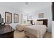 Bedroom with two twin beds and dark wood furniture at 256 Lancaster Dr, Davenport, FL 33897