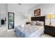 Bedroom with queen bed and dark wood furniture, near a full bath at 256 Lancaster Dr, Davenport, FL 33897