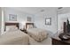 Bedroom with two twin beds and dark wood furniture at 256 Lancaster Dr, Davenport, FL 33897