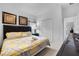 King-size bedroom with dark wood furniture and yellow bedding at 256 Lancaster Dr, Davenport, FL 33897