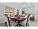 Formal dining room with a dark wood table and six chairs at 256 Lancaster Dr, Davenport, FL 33897