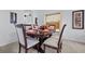 Formal dining room with a dark wood table and six chairs at 256 Lancaster Dr, Davenport, FL 33897