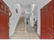 Bright entryway with staircase to the second floor at 256 Lancaster Dr, Davenport, FL 33897
