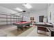 Game room features pool table and air hockey at 256 Lancaster Dr, Davenport, FL 33897